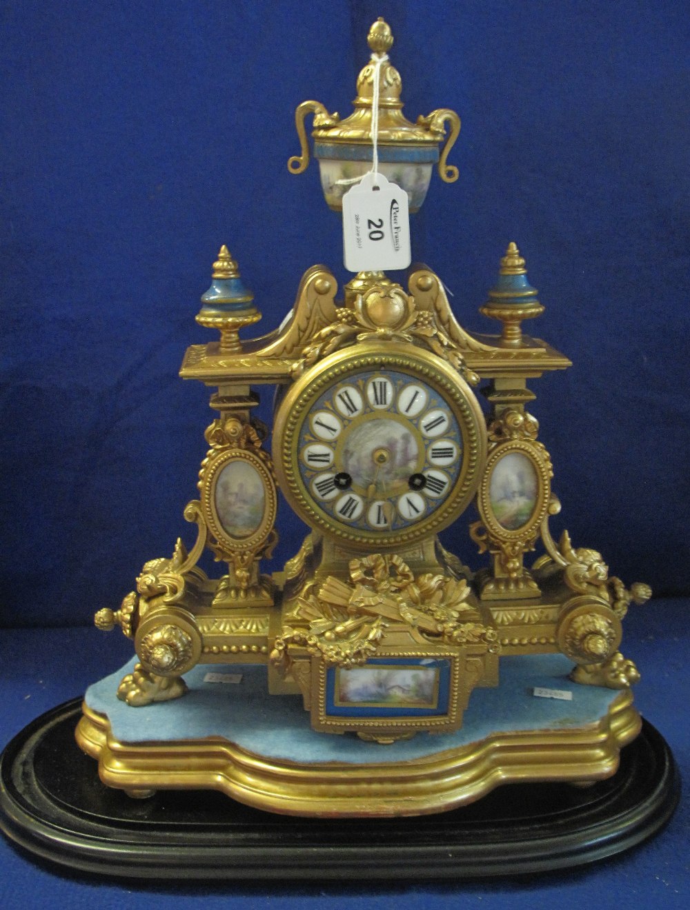 19th Century French gilt metal architectural mantel clock with porcelain panels and urn shaped