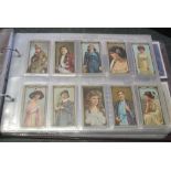 Maroon album of cigarette cards, Grandee cards, Tom Thumb cards, Doncella cards.