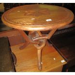 Hardwood foliate carved circular occasional table with entwined pedestal. (B.P. 24% incl.