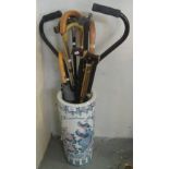 Modern ceramic stick stand comprising various sticks and umbrellas etc. (B.P. 24% incl.