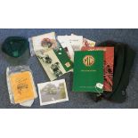 MG green bag containing assorted books, badges, cap and other MG ephemera, MMM yearbook 2000,