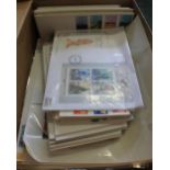 Shoebox of Great Britain First Day Covers, stamps on pages and a few World Stamps in Junior Albums.