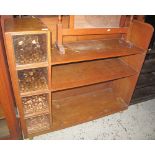 20th Century oak bookcase with an arrangement of compartments on wheels. (B.P. 24% incl.