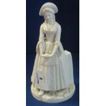 Royal Worcester porcelain figurine of a standing crinoline lady.