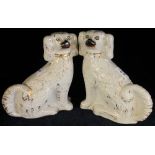 Pair of Staffordshire pottery seated spaniels with gilt decoration and painted faces. (2) (B.P.