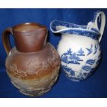 Wedgwood blue and white willow pattern transfer printed, helmet shaped jug. 25cm high.