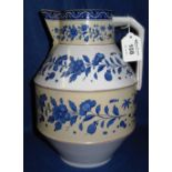 Staffordshire Pottery baluster shaped blue and white florally decorated jug with angular handle.