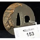 Japanese iron and bronze tsuba decorated with bronze relief of a perching eagle,