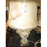 German porcelain florally decorated and encrusted lamp base with gilt metal platform support and
