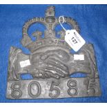 Lead fire mark in the form of a pair of clasped hands under a crown with the no. 80585 below. 19.