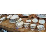 Two trays of Royal Albert Crown china teaware on a white ground with gilt swag and floral