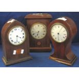 Three Edwardian inlaid mahogany boudoir clocks in different designs. (3) (B.P. 24% incl.