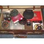 Leather suitcase containing assorted fly fishing centre pin reels,