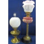 Early 20th Century brass double burner oil lamp with graduated repousse glass reservoir,