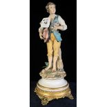 Continental figure of a young man with flowers, marked: Cazpie, on gilt metal design pedestal base.