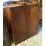 Edwardian mahogany two door, blind panelled cupboard on a platform base. (B.P. 24% incl.