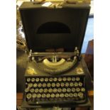 Vintage Imperial portable type writer with hinged cover,