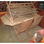 Two modern teak garden tables with various teak folding garden chairs. (B.P. 24% incl.