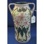 Moorcroft art pottery waisted two handled cylinder vase with tube lined floral decoration on a