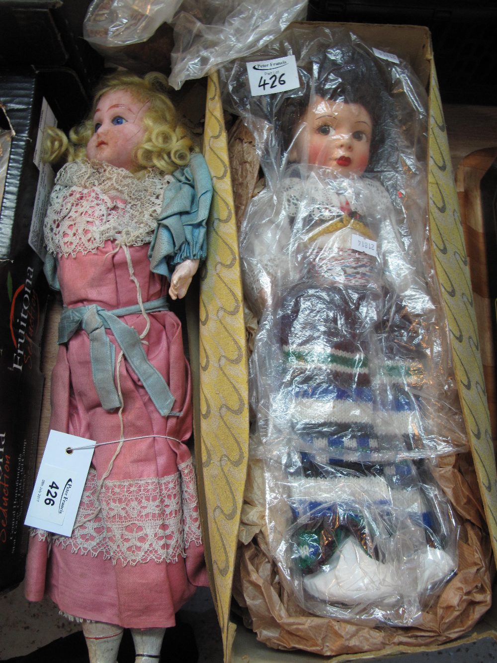Victorian wooden body wax headed wooden doll with glass eyes and natural wig in fitted attire,