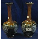 Pair of Royal Doulton stoneware baluster shaped vases with extended necks and portrait panels on