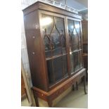 19th Century mahogany bookcase in 18th Century style with moulded cornice over a pair of lancet