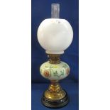 Early 20th Century brass double burner oil lamp with ceramic floral reservoir,