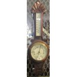 Carved oak wall barometer marked O. Davies Jeweller and Optician Lampeter. (B.P. 24% incl.