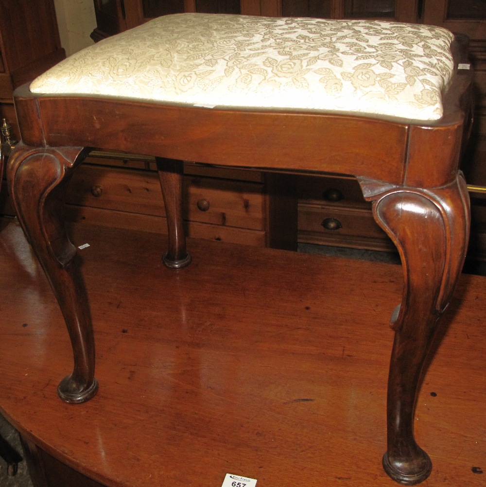 Early 20th Century mahogany upholstered footstool on cabriole legs and pad feet. (B.P. 24% incl.