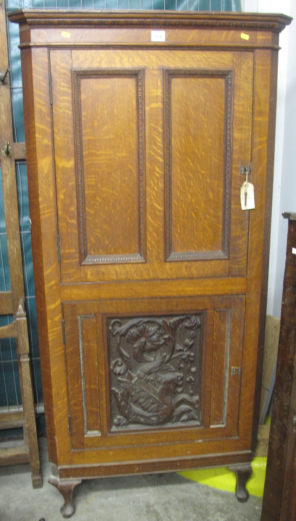 19th Century carved oak free standing corner cupboard on cabriole legs. (B.P. 24% incl.
