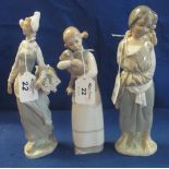 Three small Lladro porcelain figurines; girl flower seller, young girl with lamb and sisters.