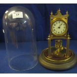 Early 20th Century brass 100 day perpetual motion dome clock. (B.P. 24% incl.