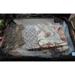 Box containing various fabrics including a gold embroidered throw of Asian design,