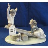 Lladro porcelain figure group; children playing on seesaw with puppy. Printed and impressed marks.