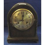 Mid 20th Century oak arch shaped, two train mantel clock. (B.P. 24% incl.