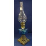 Early 20th Century single burner oil lamp with blue glass reservoir and clear funnel. (B.P.