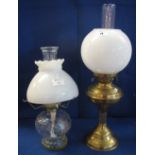 Brass double burner oil lamp with clear funnel and cream shade,