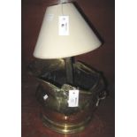 Brass helmet shaped coal scuttle, together with brass Corinthian column table lamp with shade.