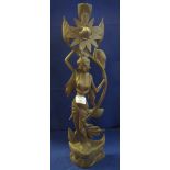 Modern wooden carving of a female and flower on naturalistic type base. (B.P. 24% incl.