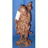 Japanese carved rootwood figure of a fisherman with catch on naturalistic base. (B.P. 24% incl.