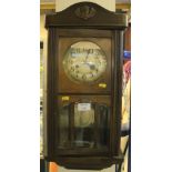 Mid 20th Century oak cased, two train wall clock. (B.P. 24% incl.