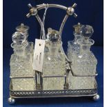 EPNS pierced six section cruet set raised on four ball feet. (B.P. 24% incl.