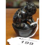 Carved hardwood Japanese netsuke with signature to base of a big cat snarling. (B.P. 24% incl.