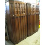 Mid 20th Century oak bedroom suite comprising: two similar wardrobes and a mirror backed dressing