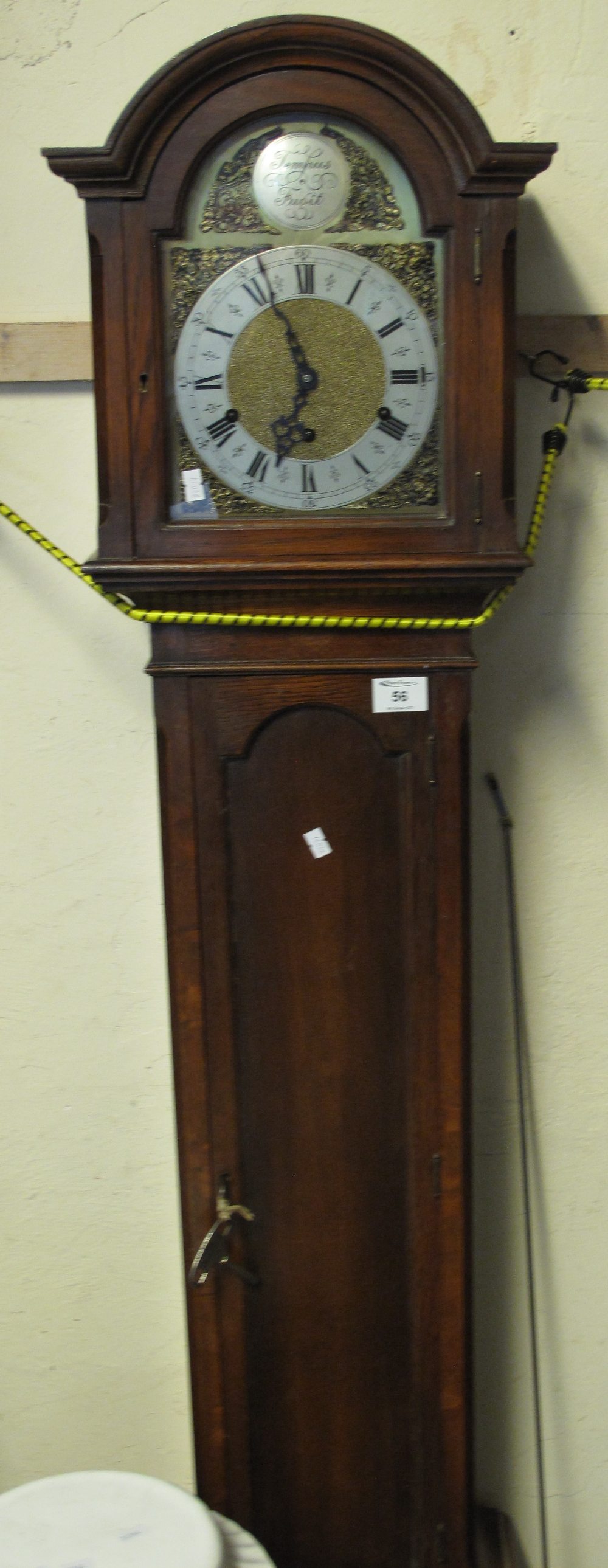 Mid 20th Century oak two train grandmother clock with arched brass face, having silver chapter ring.