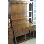 Small and narrow oak reproduction two stage, rack back, pot board dresser. (B.P. 24% incl.