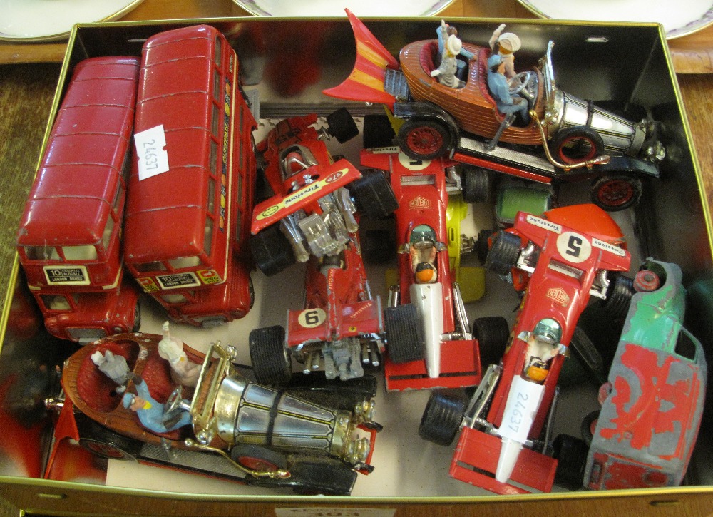 Small tin containing assorted play worn,