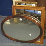 Stained oak framed, oval bevelled mirror,
