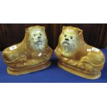 Pair of late 19th Century Staffordshire pottery recumbent lions. (2) (B.P. 24% incl.