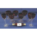 Selection of ruby glass to include assorted drinking vessels together with double ended,